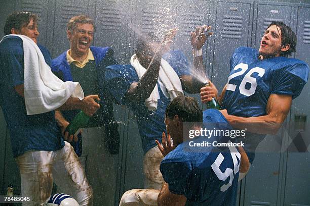 football team celebrating - spraying champagne stock pictures, royalty-free photos & images