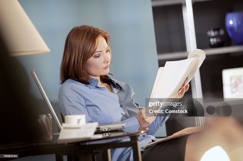 Woman reading paperwork
