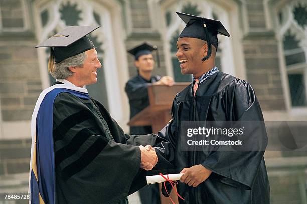 man receiving diploma - receiving stock pictures, royalty-free photos & images