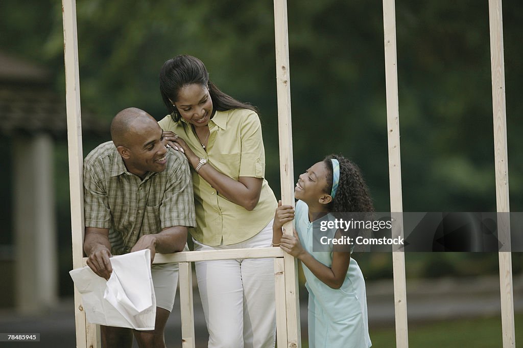 Family on home construction site