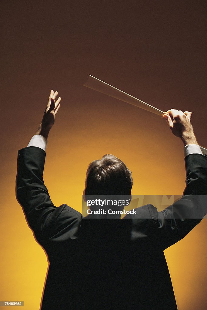 Symphony conductor conducting