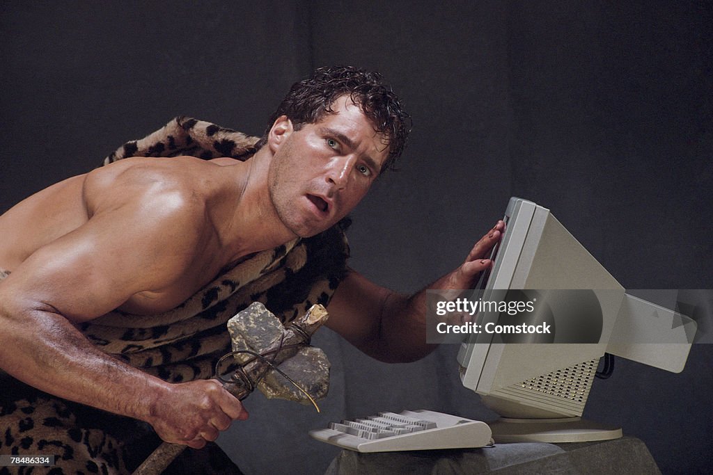 Caveman Vs Computer Caveman Baffled By Computer High-Res Stock Photo - Getty Images