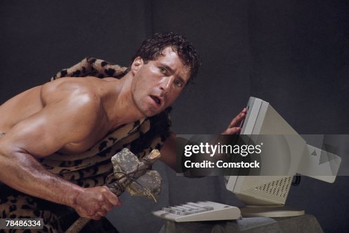 Caveman baffled by computer Caveman baffled by computer