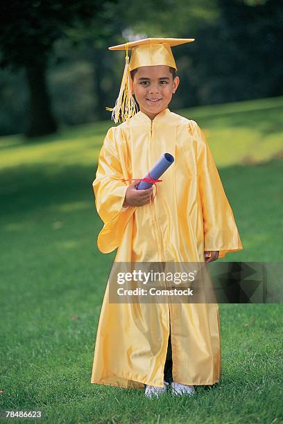 young boy graduate - footage technique stock pictures, royalty-free photos & images