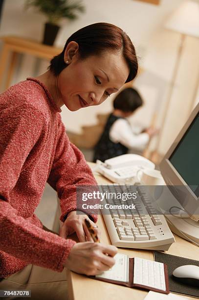 Woman Writecheck 114 Writing A Check Checkbook Stock Photos, High-Res Pictures, and ...