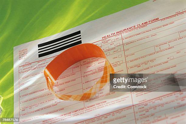health insurance forms - hospital bracelet stock pictures, royalty-free photos & images