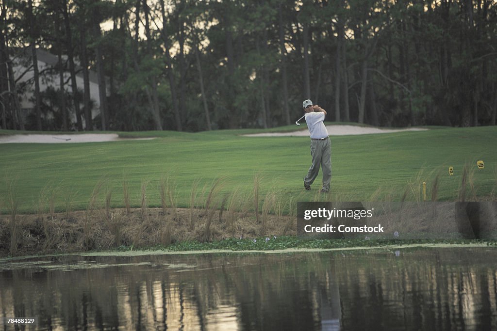 Man playing golf