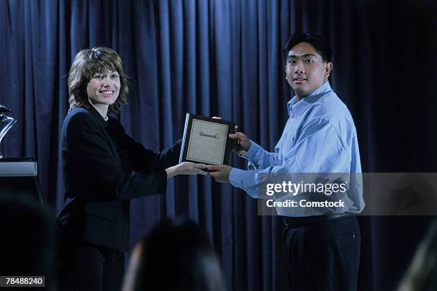 businesspeople accepting an award - receiving award stock pictures, royalty-free photos & images