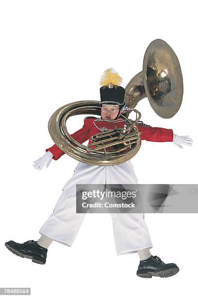 boy with a tuba - tube foto e immagini stock