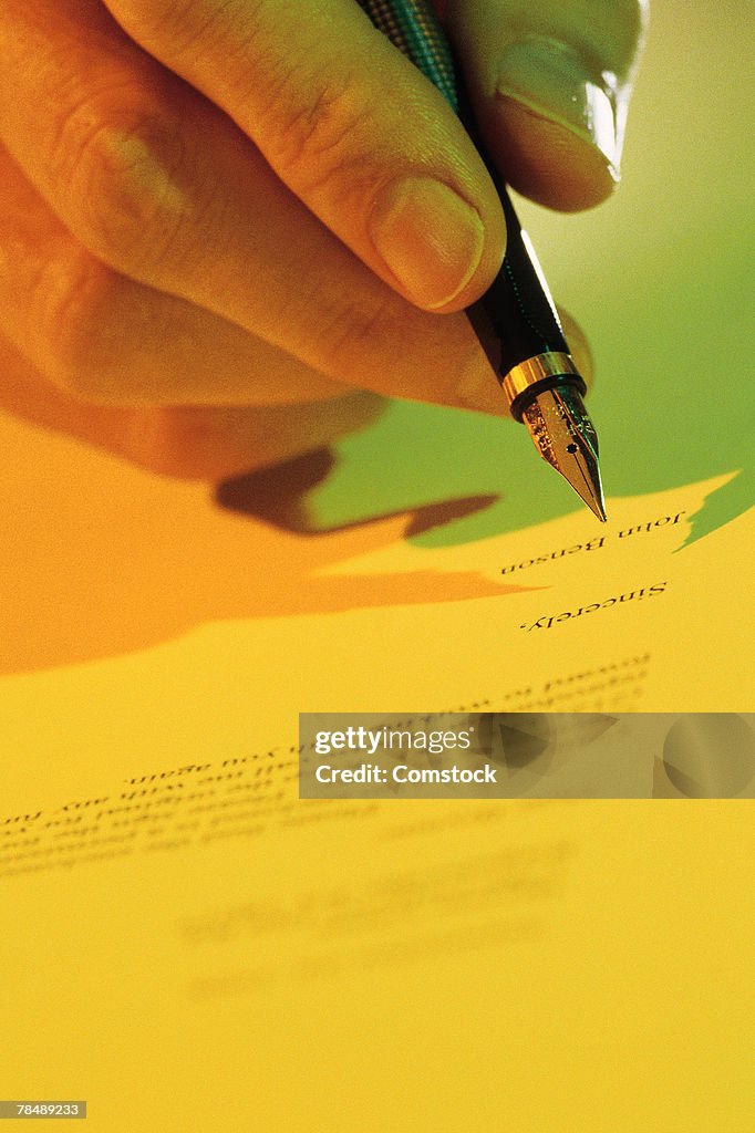 Hand Signining Hand Signing Paper High-Res Stock Photo - Getty Images