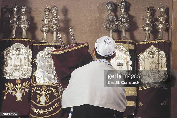 young man participating in a religious ceremony - bar mitzvah stock pictures, royalty-free photos & images