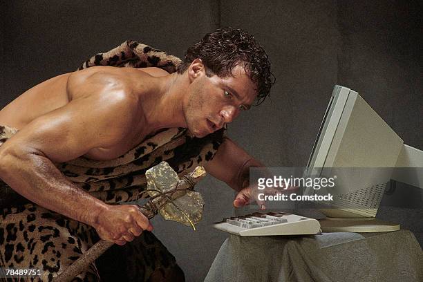 caveman with computer - stone age stockfoto's en -beelden