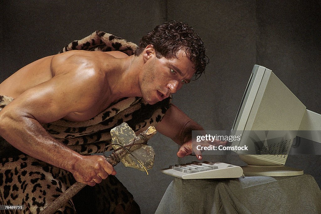 Caveman with computer