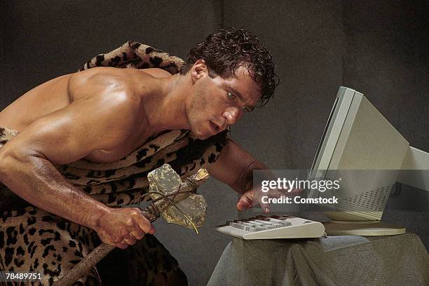 caveman with computer - stone age stock pictures, royalty-free photos & images