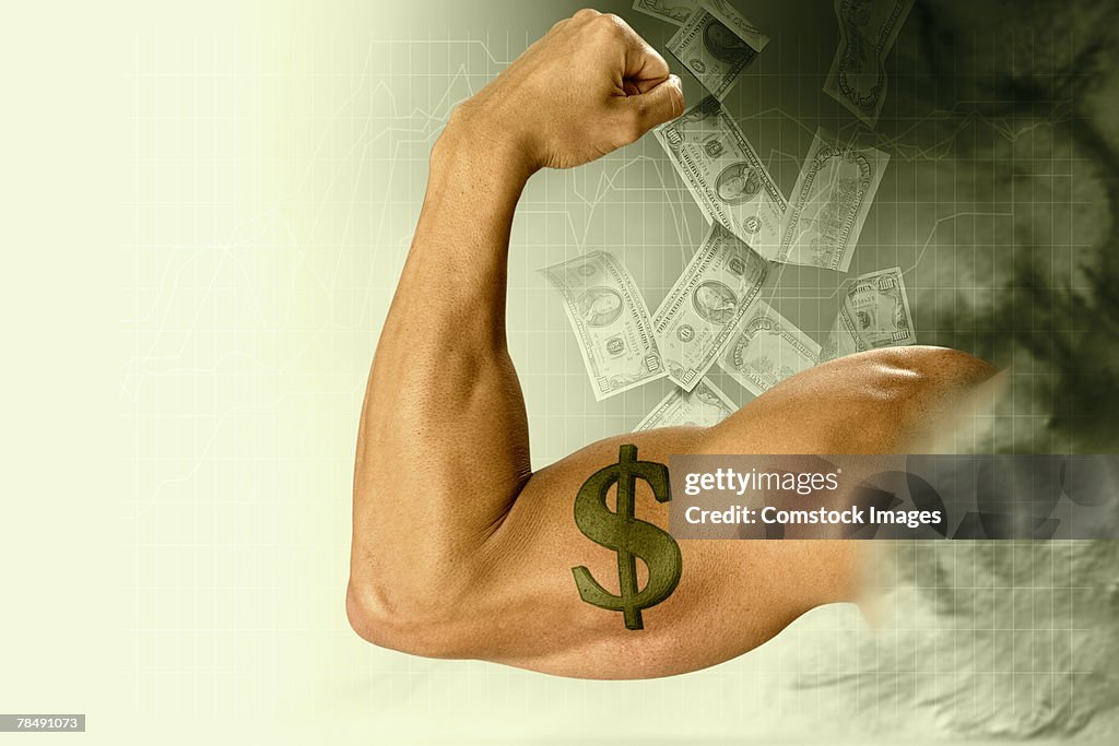 Man flexing a muscular arm with dollar sign tattoo surrounded by falling money