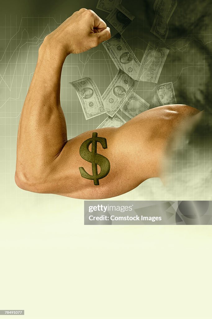 Man flexing a muscular arm with dollar sign tattoo surrounded by falling money