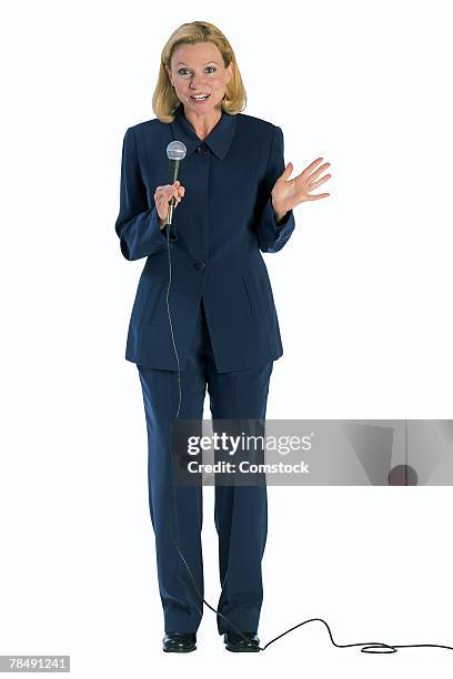 woman with microphone - compere stock pictures, royalty-free photos & images