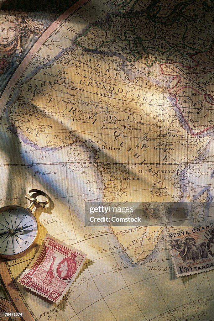 Map of Africa with compass and stamps