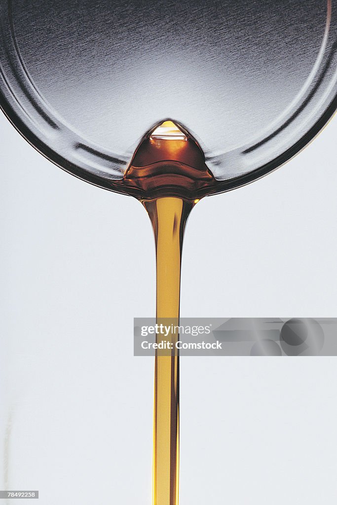 Motor oil pouring from can
