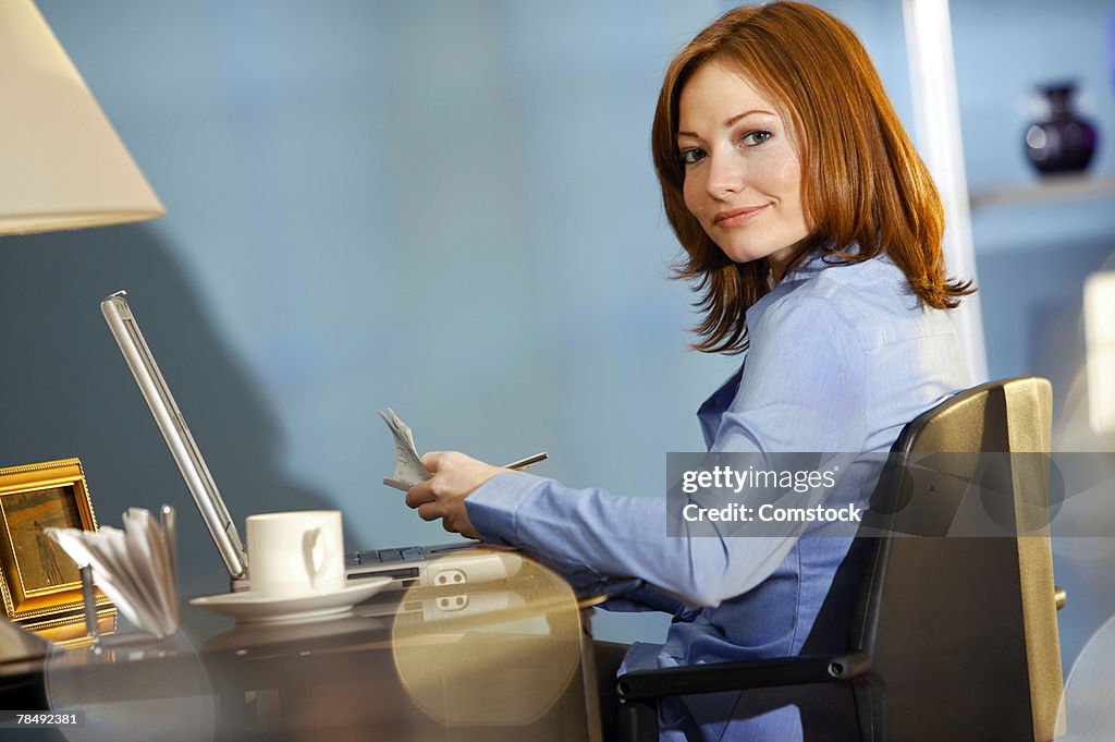 Woman paying bills