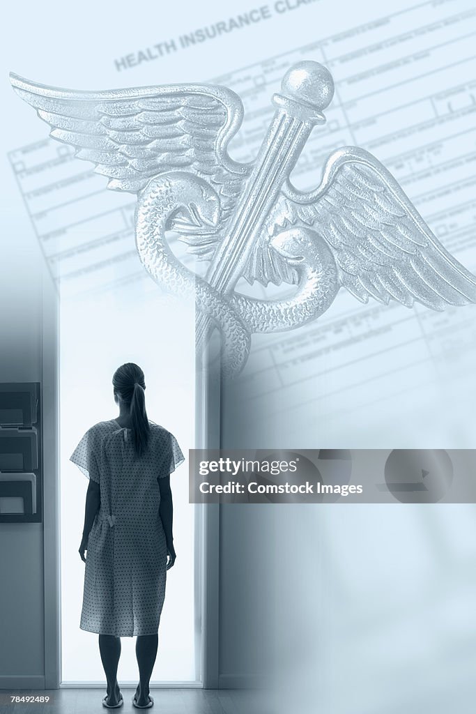 Woman in hospital gown and medical symbol