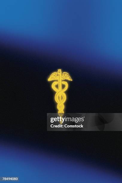 medical symbol - gold caduceus stock-fotos und bilder