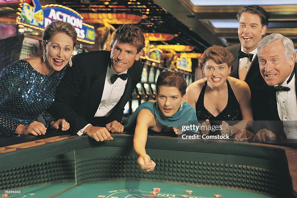 Group of people playing craps at casino