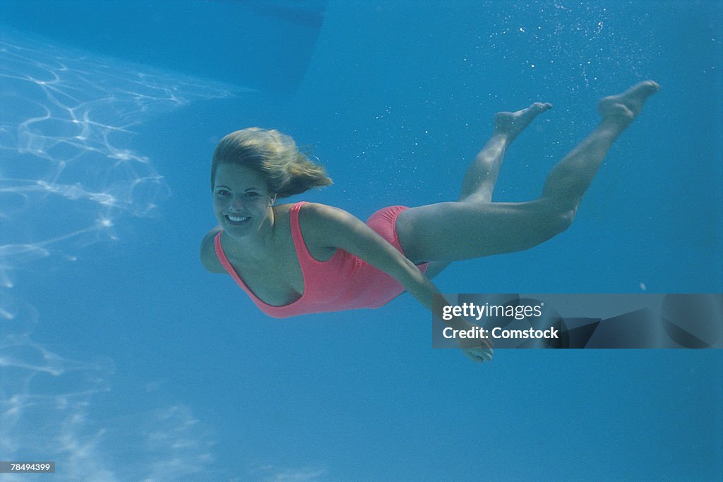 Woman swimming underwater