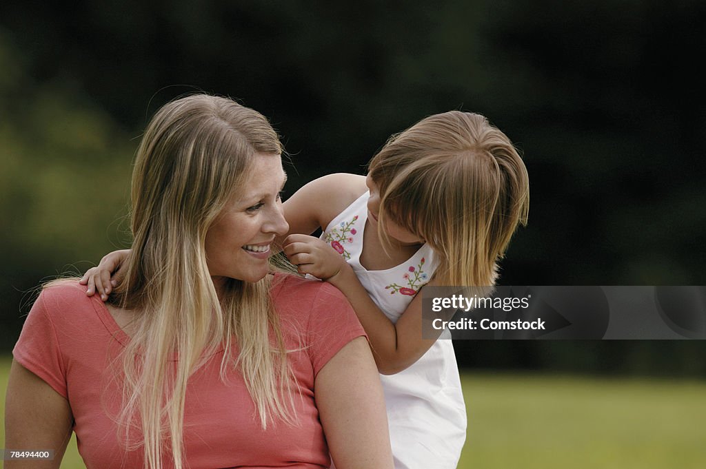 Mother and daughter outdoors