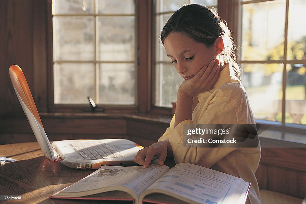 Girl studying with laptop