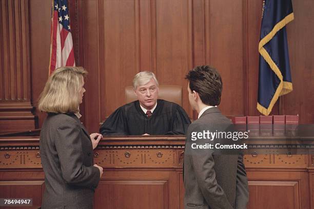 judge and lawyers in courtroom - judge bench stock pictures, royalty-free photos & images