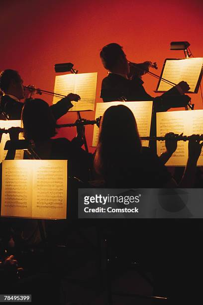 silhouette of classical orchestra - orchestra sinfonica foto e immagini stock