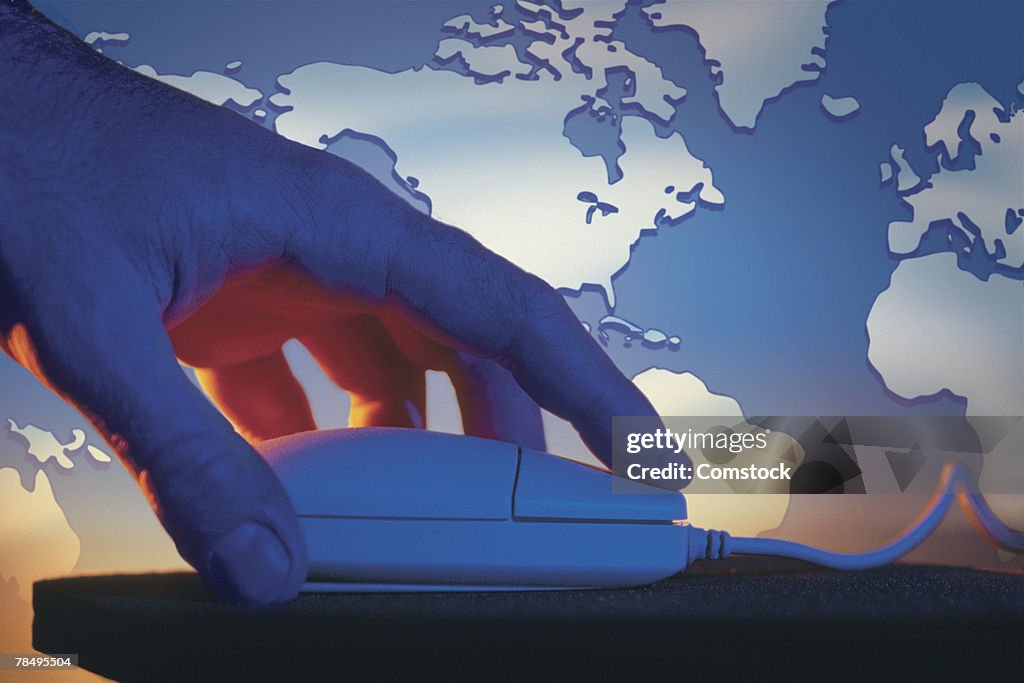 Digital Form Using A Computer Mouse Hand Using Computer Mouse With World Map High-Res Stock Photo - Getty ...