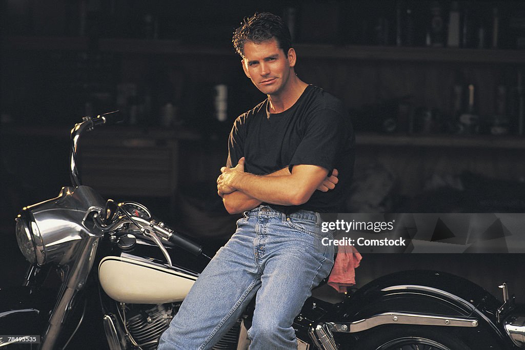 Man posing with motorcycle