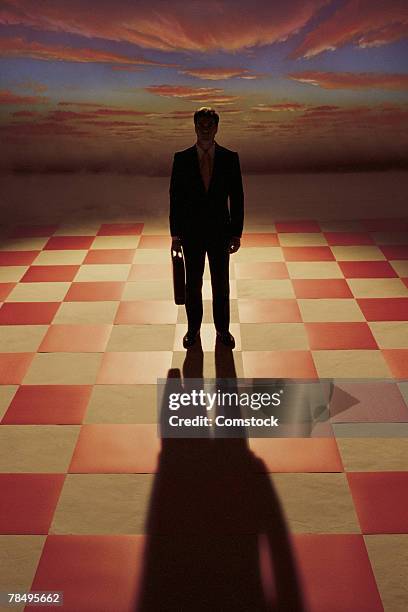 silhouette of businessman on chessboard - chess board without stock pictures, royalty-free photos & images