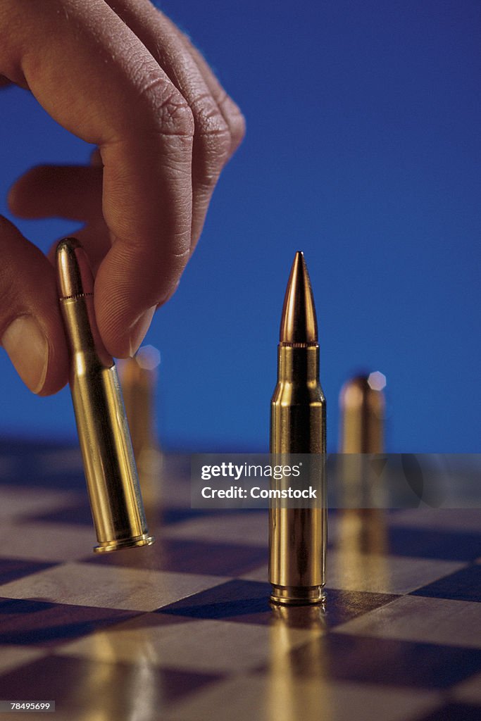 Chess board with bullets