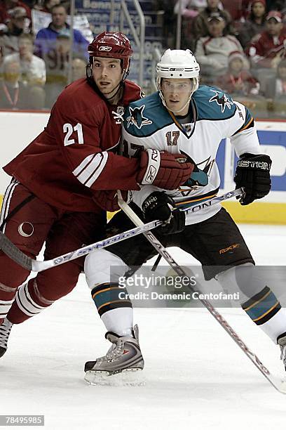 Bill Thomas of the Phoenix Coyotes and Torrey Mitchell of the San Jose Sharks skate during the NHL game at the Jobing.com Arena on December 7, 2007...