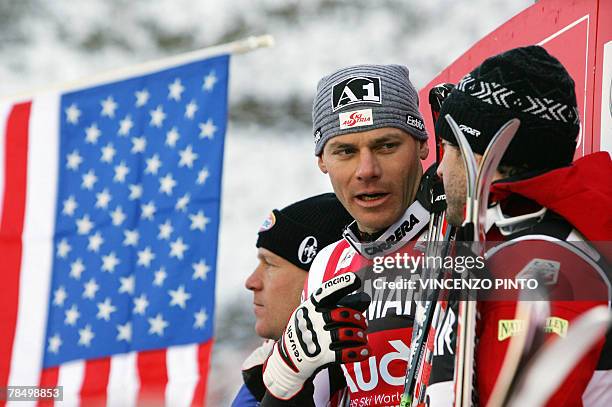 Austrian Michael Walchhofer celebrates on podium of the Mens FIS Alpine World Cup Downhill event in Val Gardena, 15 December 2007. Walchhofer won the...