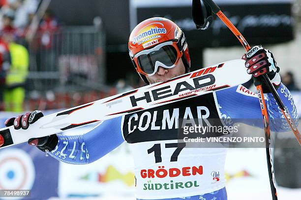 Swiss Didier Cuche kiss his ski in celebration of his 2nd place finish in the Mens FIS Alpine World Cup Downhill event in Val Gardena, 15 December...