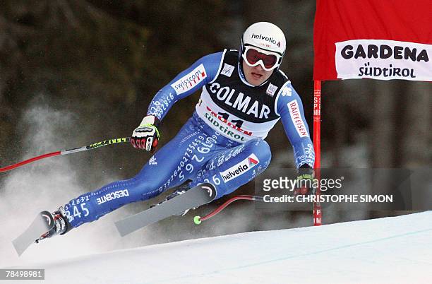 Swiss Ambrosi Hoffmann clears a gate and clocks the 5th fastest time during the Men's FIS Alpine World Cup Downhill event in Val Gardena, 15 December...
