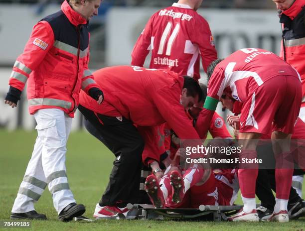 Ludovic Magnin of Stuttgart receives medical treatment during the Bundesliga match between Arminia Bielefeld and VfB Stuttgart at the Schueco Arena...