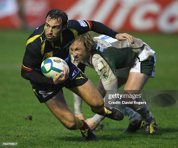 Cedric Rosalen of Perpignan moves away from Peter Richards during the Heineken Cup match between Perpignan and London Irish at Stade Aime Giral on...