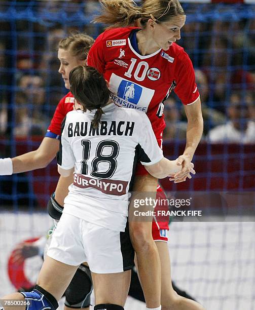 Norway's Gro Hammerseng vies with Germany's Maren Baumbach during the women world championship handball semi final match Norway vs. Germany, 15...