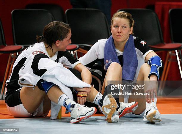 German players look dejected after loosing the Women's Handball World Championship semi final match between Germany and Norway at the Palais...