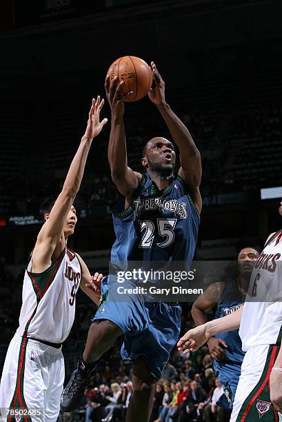 Al Jefferson of the Minnesota Timberwolves drives to the basket against Yi Jianlian and Andrew Bogut of the Milwaukee Bucks on December 15, 2007 at...