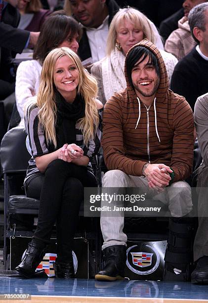 Singer Ashlee Simpson and musician Pete Wentz of Fall Out Boy attend NJ Nets vs NY Knicks game at Madison Square Garden in New York City on December...