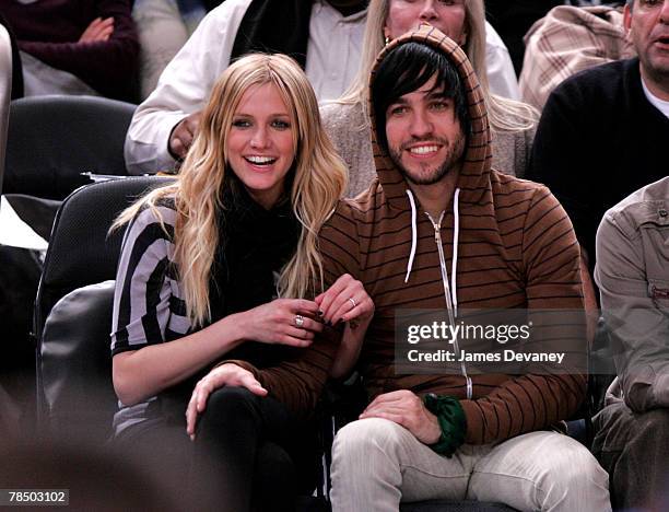 Singer Ashlee Simpson and musician Pete Wentz of Fall Out Boy attend NJ Nets vs NY Knicks game at Madison Square Garden in New York City on December...