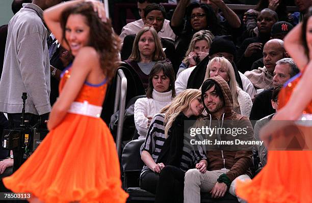 Singer Ashlee Simpson and musician Pete Wentz of Fall Out Boy attend NJ Nets vs NY Knicks game at Madison Square Garden in New York City on December...