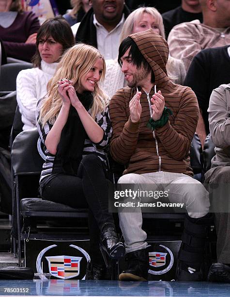 Singer Ashlee Simpson and musician Pete Wentz of Fall Out Boy attend NJ Nets vs NY Knicks game at Madison Square Garden in New York City on December...