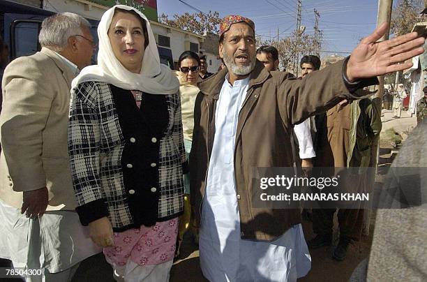 Pakistani former prime minister Benazir Bhutto arrives at the house of Talal Bugti, son of slain rebel tribal chief Nawab Akbar Bugti during her...